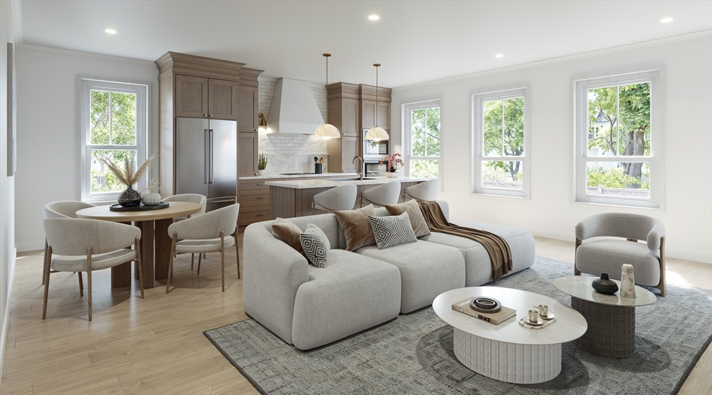 257 R Market Street, Unit 1 Boston, MA 02135 - Photo 3 of 9 a living room with furniture and a large window