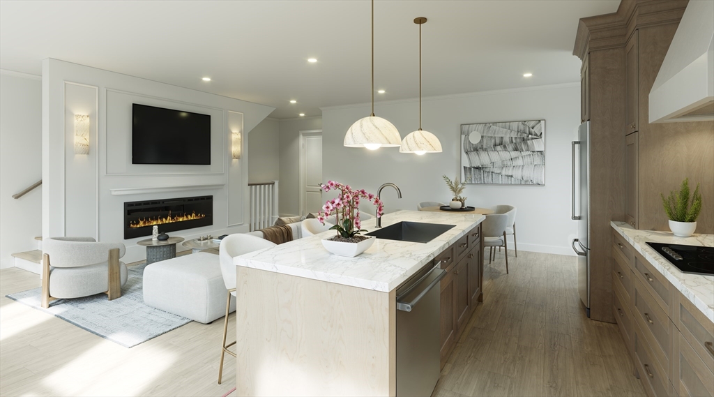 257 R Market Street, Unit 1 Boston, MA 02135 - Photo 4 of 9 a kitchen with a sink cabinets and a stove