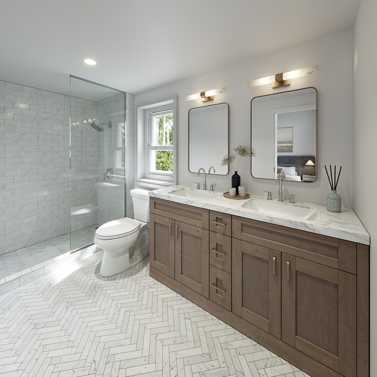 257 R Market Street, Unit 1 Boston, MA 02135 - Photo 6 of 9 a spacious bathroom with a double vanity sink a toilet and a mirror