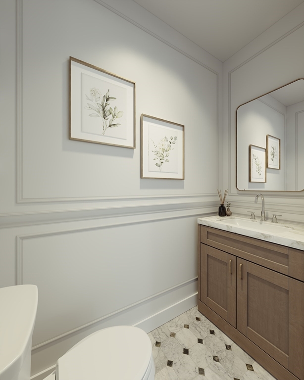 257 R Market Street, Unit 1 Boston, MA 02135 - Photo 9 of 9 a bathroom with a toilet a sink and a mirror