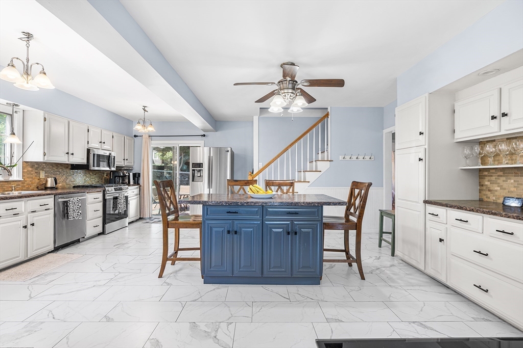 3 Fitz Road Peabody, MA 01960 - Photo 3 of 34 a open kitchen with cabinets and chairs