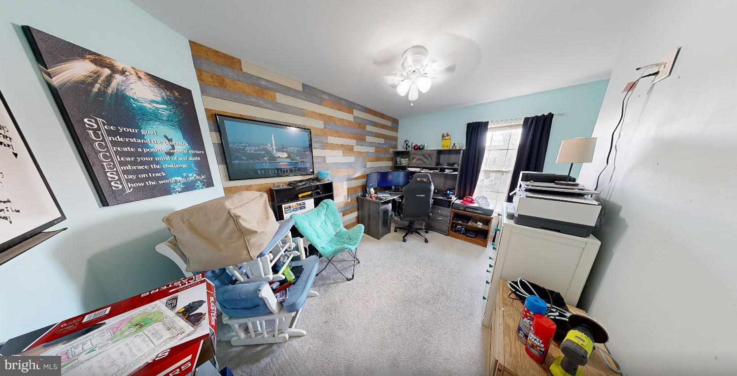 110 Trafford Drive Chestertown, MD 21620 - Photo 17 of 26 a living room with furniture and a flat screen tv