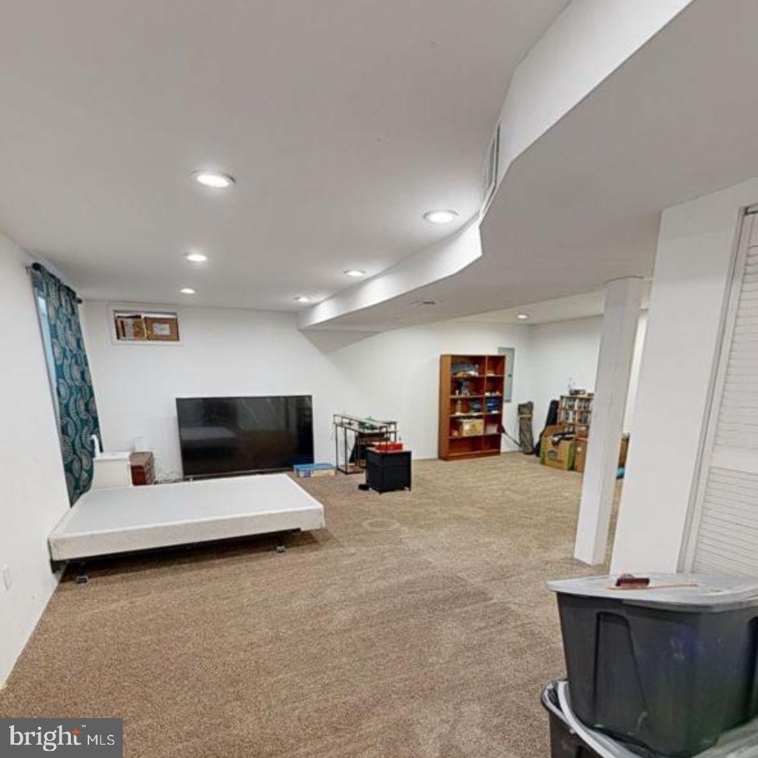 110 Trafford Drive Chestertown, MD 21620 - Photo 23 of 26 a living room with furniture and a flat screen tv