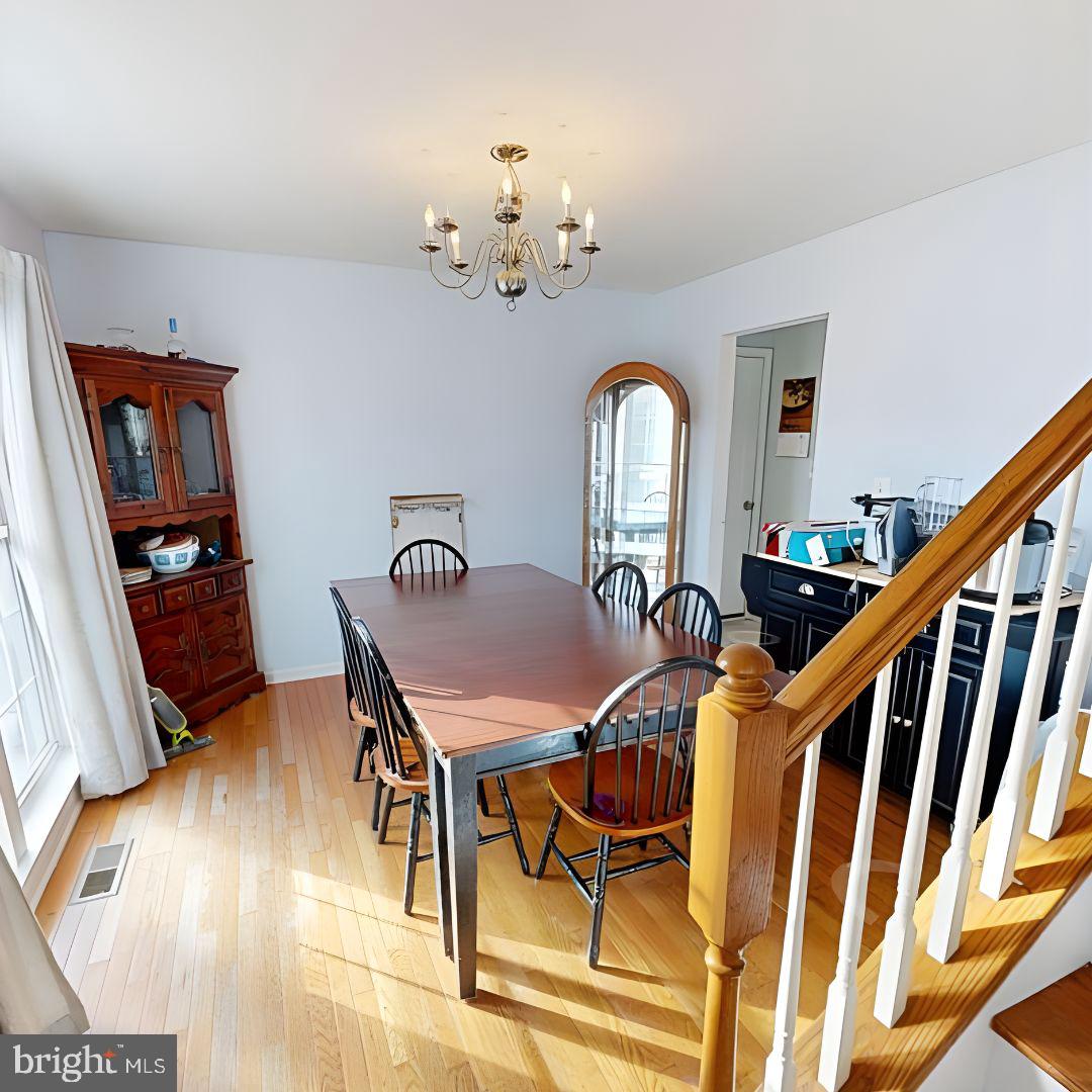 110 Trafford Drive Chestertown, MD 21620 - Photo 4 of 26 a view of a dining room with furniture and wooden floor
