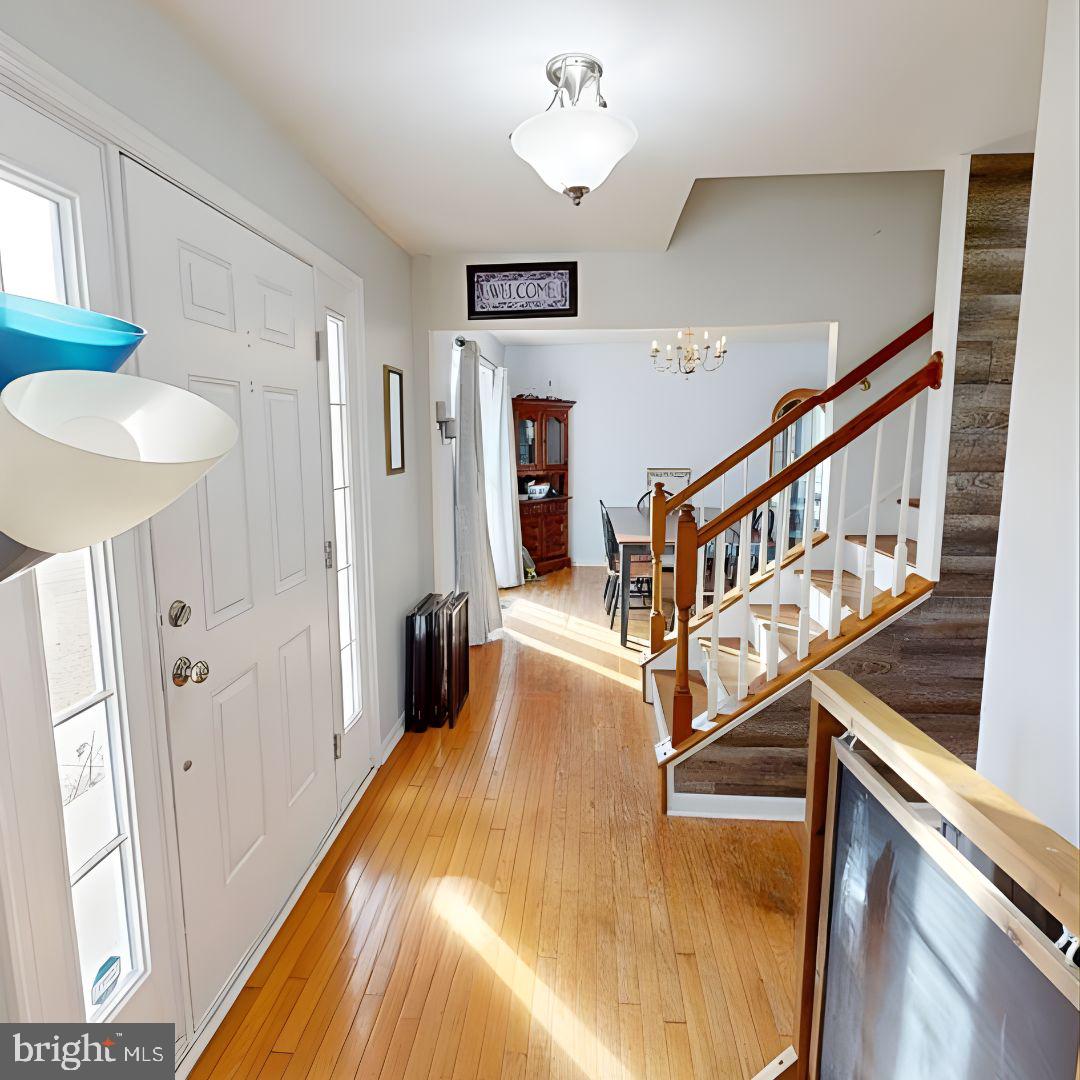 110 Trafford Drive Chestertown, MD 21620 - Photo 6 of 26 a view of a livingroom with furniture a bedroom wooden floor and windows