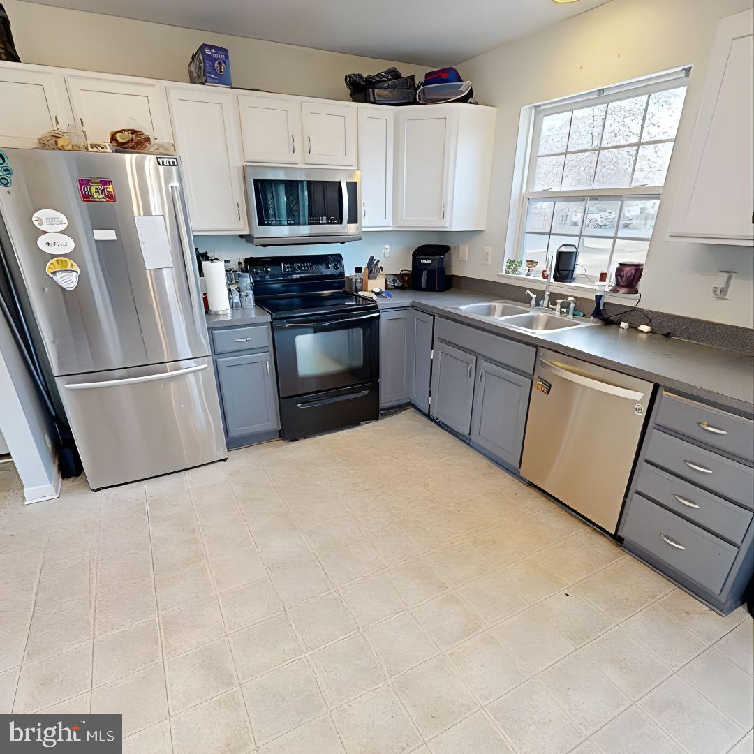 110 Trafford Drive Chestertown, MD 21620 - Photo 7 of 26 a kitchen with stainless steel appliances a refrigerator sink and microwave