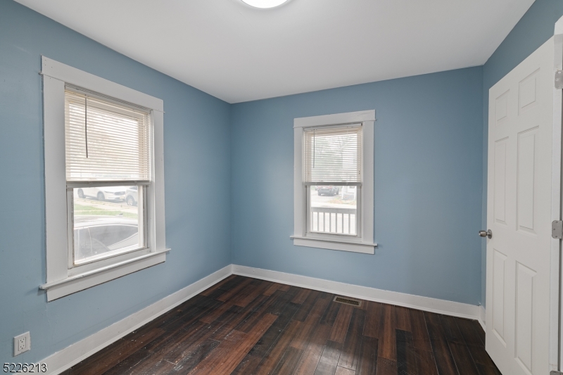 21 Ledgewood Avenue Netcong, NJ 07857 - Photo 13 of 25 a view of an empty room with wooden floor and a window