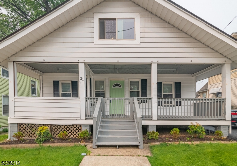21 Ledgewood Avenue Netcong, NJ 07857 - Photo 3 of 25 a view of a house with a small yard and wooden floor and fence