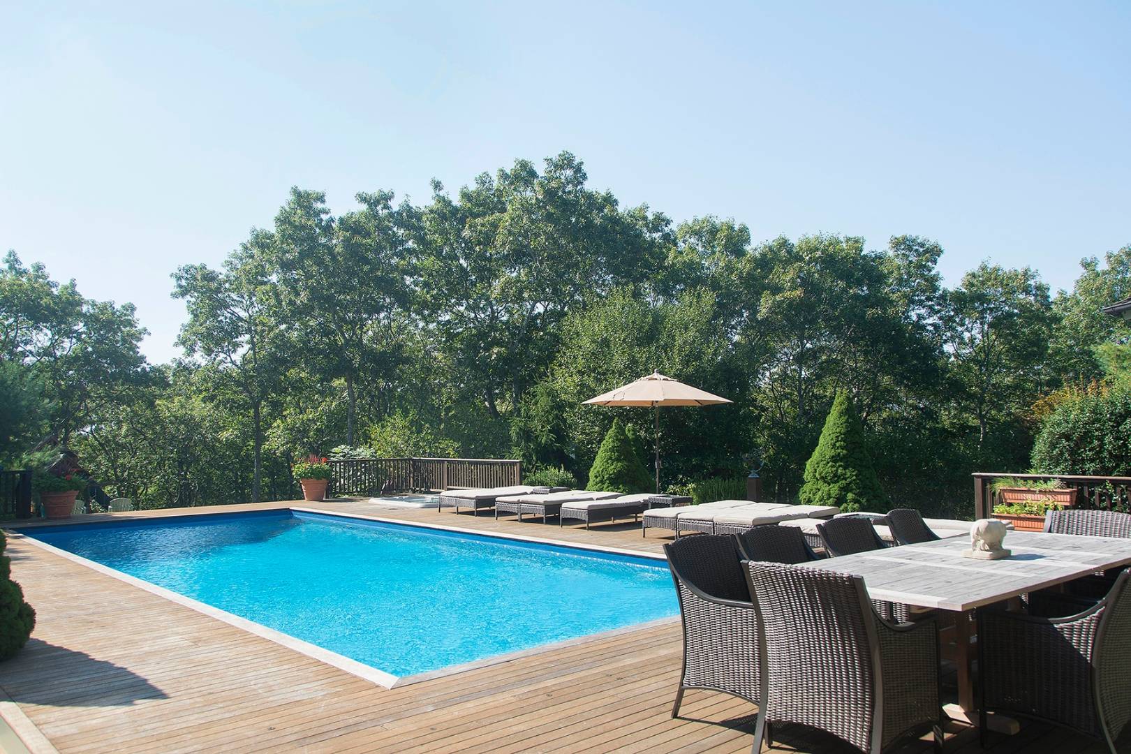 5 Highview Drive Wainscott, NY 11937 - Photo 15 of 20 a view of outdoor sitting area with furniture and umbrella