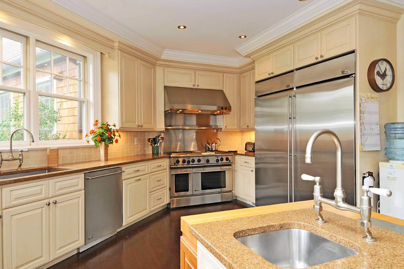 5 Highview Drive Wainscott, NY 11937 - Photo 6 of 20 a kitchen with stainless steel appliances granite countertop a sink stove and refrigerator