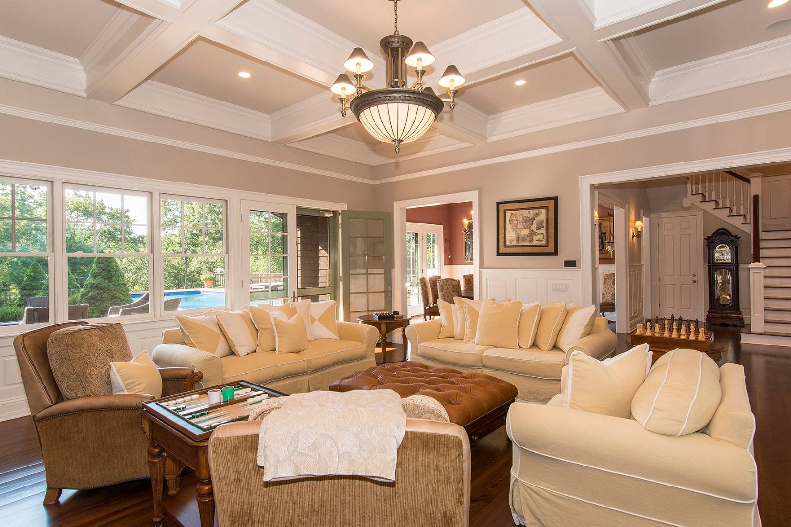 5 Highview Drive Wainscott, NY 11937 - Photo 8 of 20 a living room with furniture a chandelier and a large window