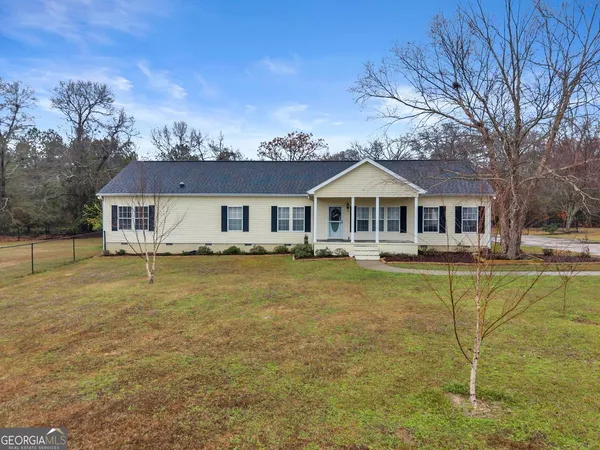 a front view of a house with swimming pool