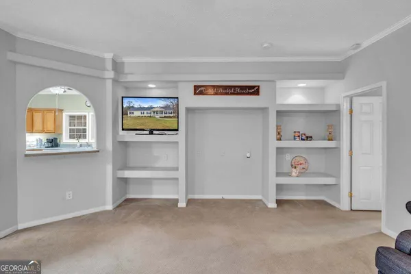 a view of room with cabinet and window