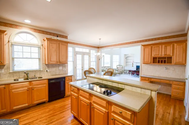 a kitchen with a stove a sink and a refrigerator