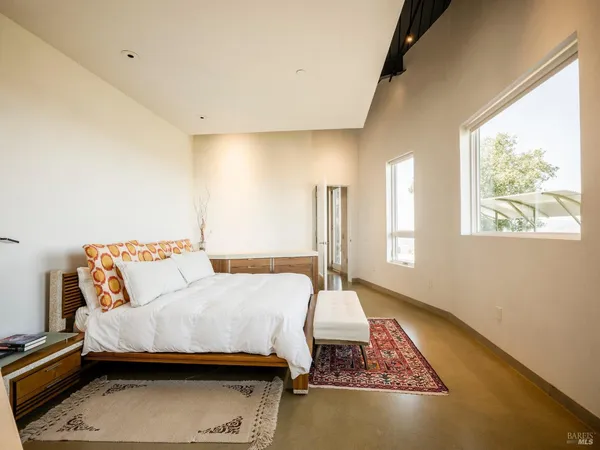 a living room with furniture and a rug