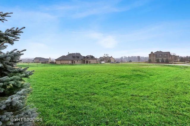 a view of a green field with clear sky