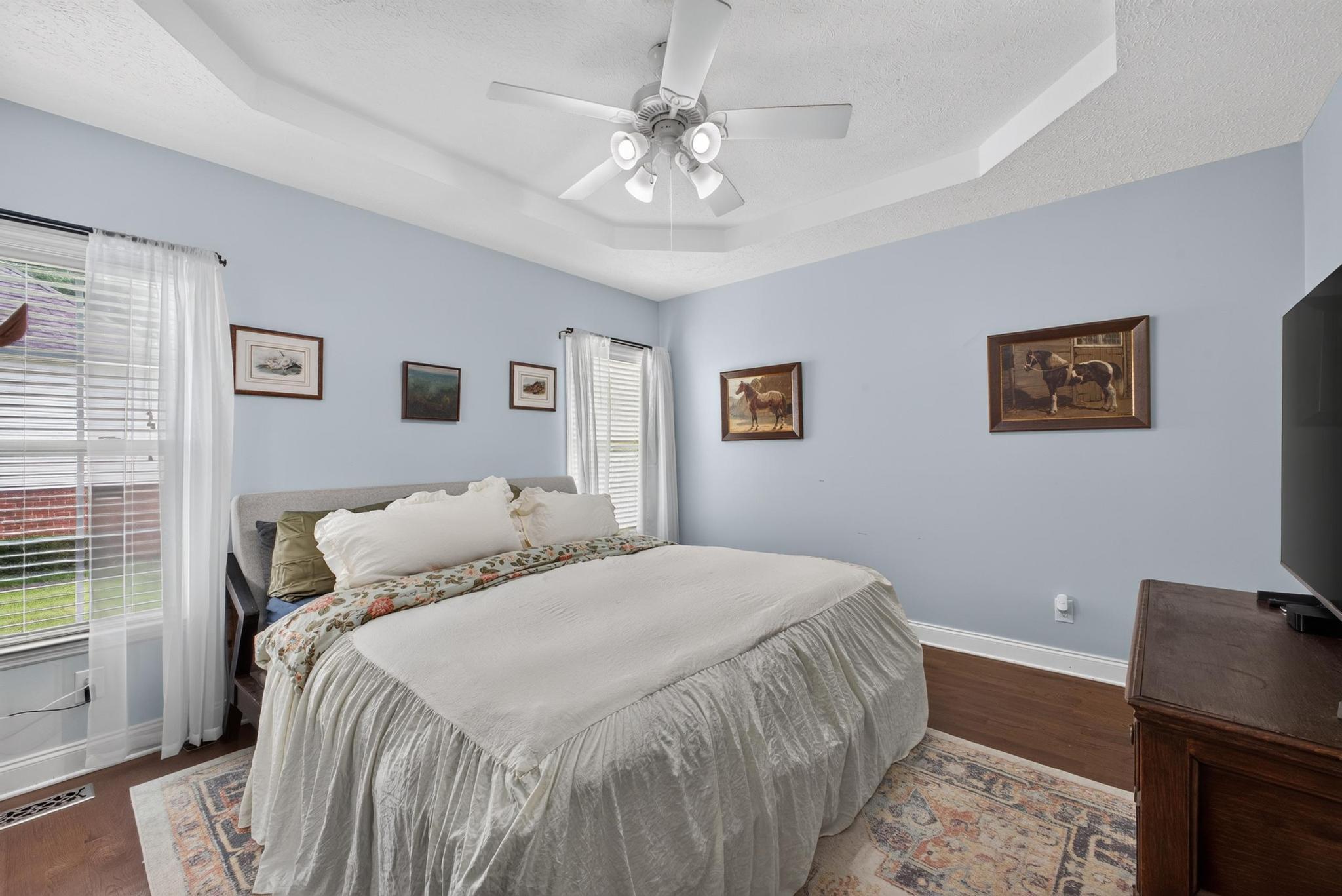 42 Emerald Ridge Aiken, SC 29803 - Photo 17 of 33 a bedroom with a bed and a chandelier