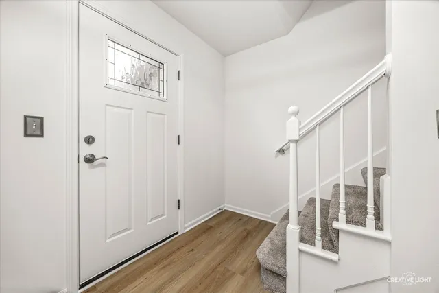 a view of entryway with wooden floor