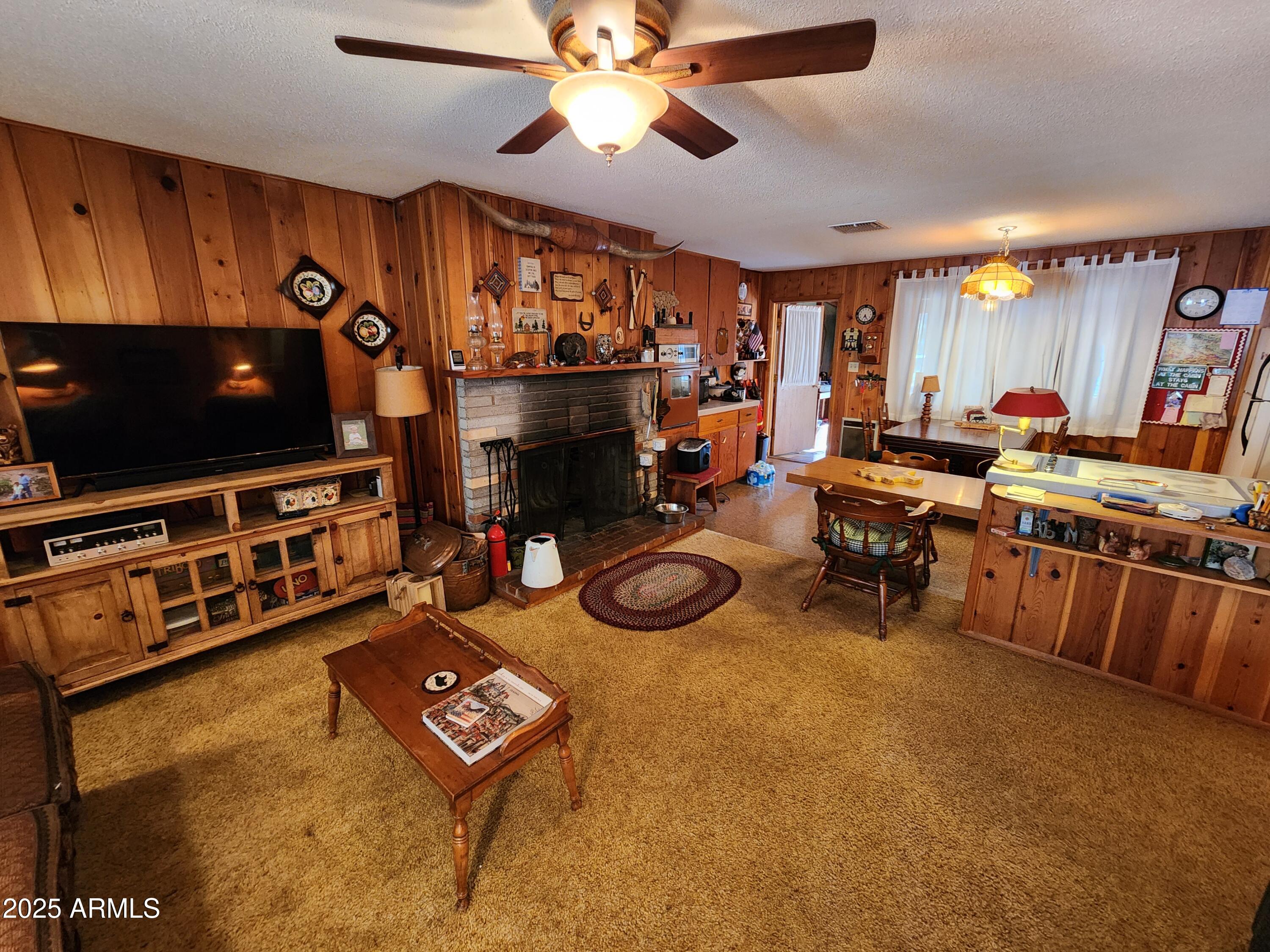 247 West Diamond Road Payson, AZ 85541 - Photo 4 of 42 a room with furniture and a flat screen tv