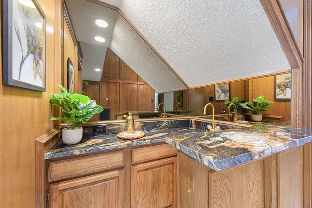 a kitchen with a sink and cabinets