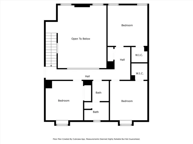 a view of a wooden chairs on the balcony