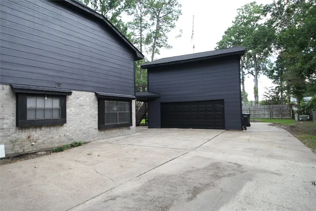 a brick house with a large tree