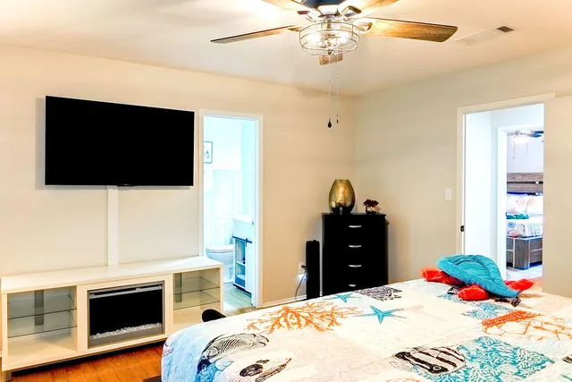 a view of a hallway with a window and a chandelier