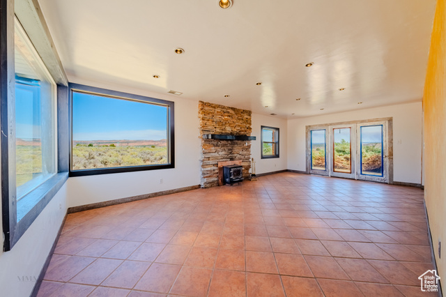 6178 East Zion Road Kanab, UT 84741 - Photo 10 of 48 Unfurnished living room with tile patterned flooring and recessed lighting
