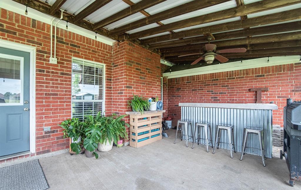 10336 Jennifer Circle Forney, TX 75126 - Photo 30 of 37 At the end of the covered patio is a large dry bar perfect for serving dinner and entertaining.
