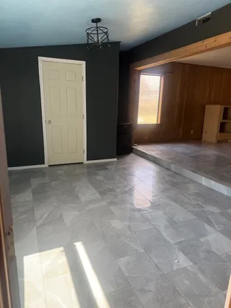a view of empty room with windows