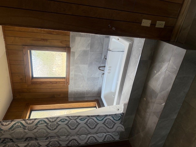 600 South Pecan Avenue Luling, TX 78648 - Photo 13 of 18 a bathroom with a bathtub and a shower