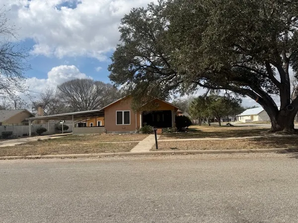 a house with trees in the background