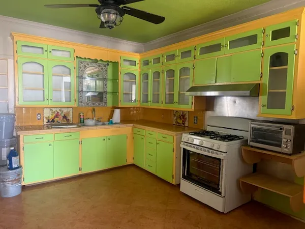 a kitchen with a stove and a sink