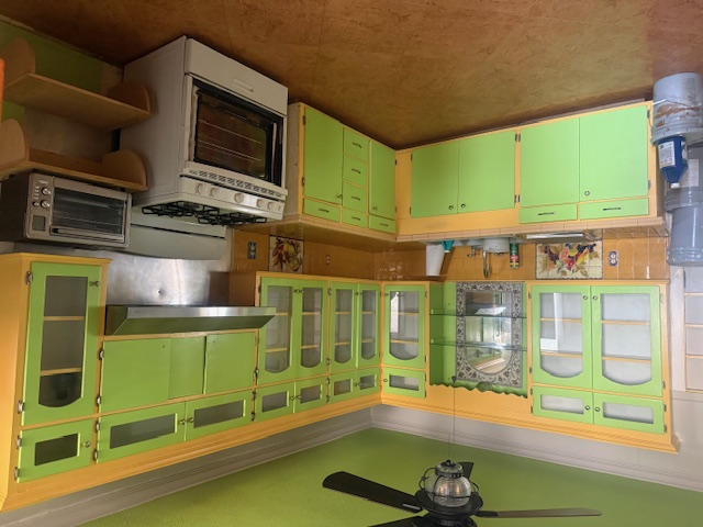 600 South Pecan Avenue Luling, TX 78648 - Photo 6 of 18 a kitchen with a stove and a sink