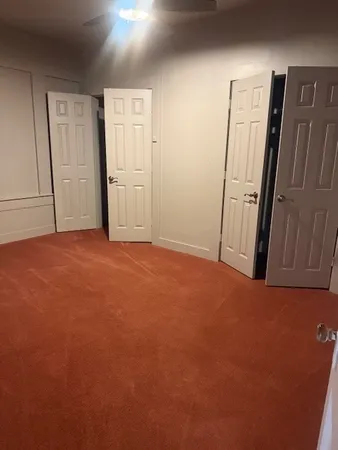 an empty room with a refrigerator