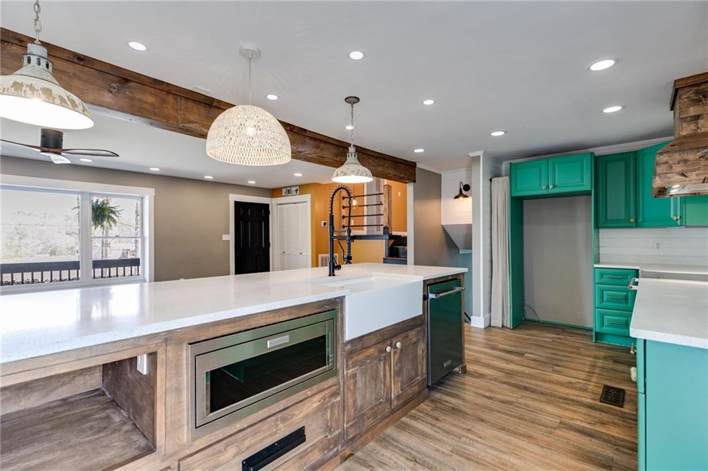 118 Raven Road Villa Rica, GA 30180 - Photo 24 of 50 a kitchen with stainless steel appliances granite countertop a large kitchen island a stove and a refrigerator