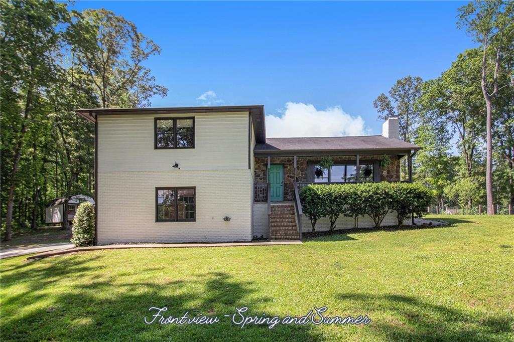 118 Raven Road Villa Rica, GA 30180 - Photo 3 of 50 a view of a house with a yard