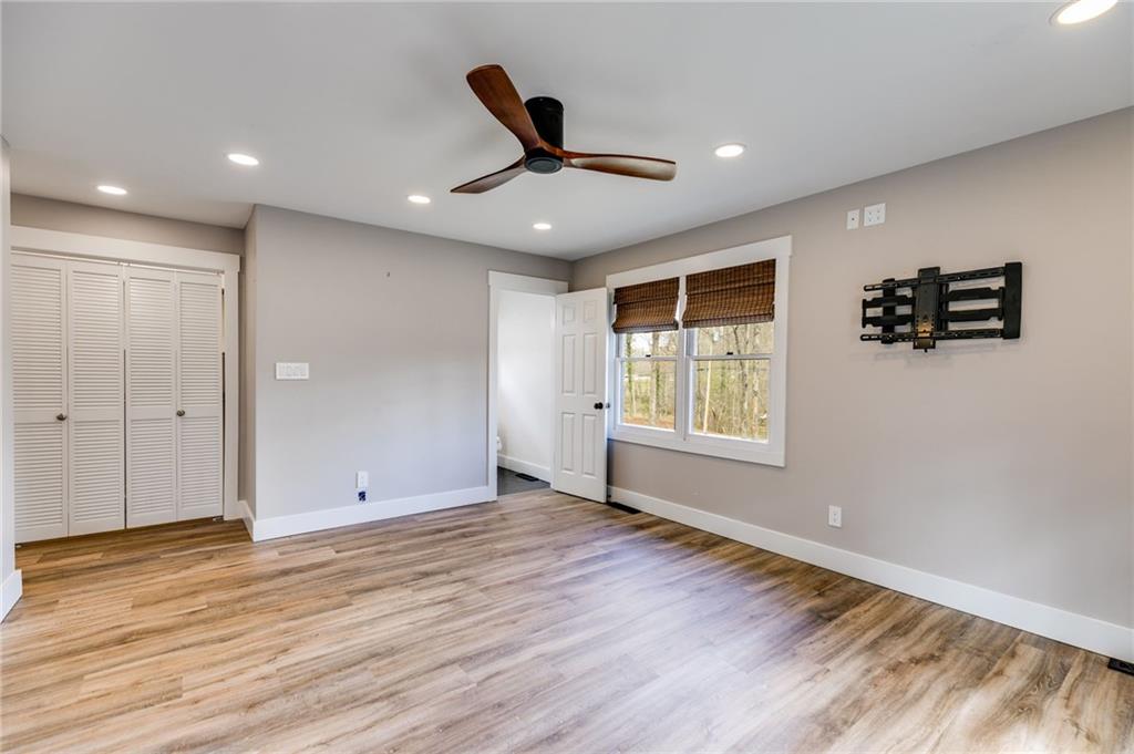 118 Raven Road Villa Rica, GA 30180 - Photo 31 of 50 a view of an empty room with wooden floor and a window