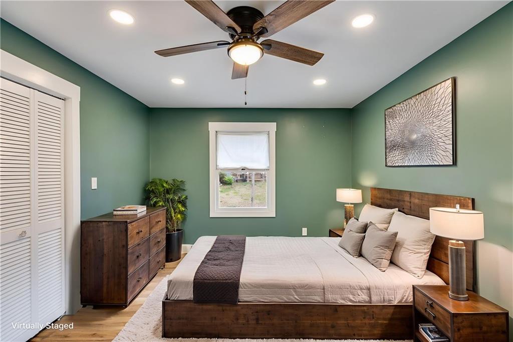 118 Raven Road Villa Rica, GA 30180 - Photo 33 of 50 a bedroom with a bed and a chandelier