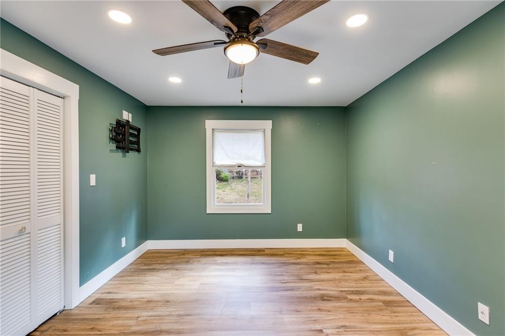 118 Raven Road Villa Rica, GA 30180 - Photo 34 of 50 a view of an empty room with a window and a ceiling fan