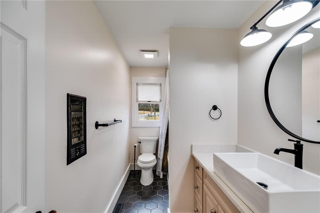 118 Raven Road Villa Rica, GA 30180 - Photo 36 of 50 a bathroom with a sink and a mirror