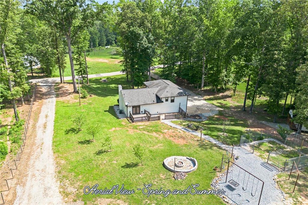 118 Raven Road Villa Rica, GA 30180 - Photo 48 of 50 a view of an house with backyard space and garden