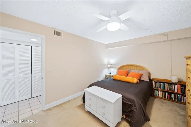 a bedroom with furniture and natural light