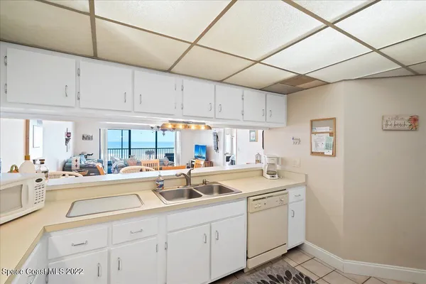 a kitchen with sink cabinets and window