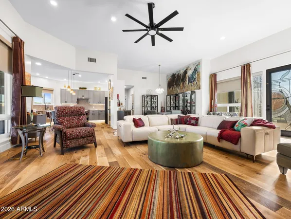 a kitchen with stainless steel appliances granite countertop a kitchen island a stove and a refrigerator