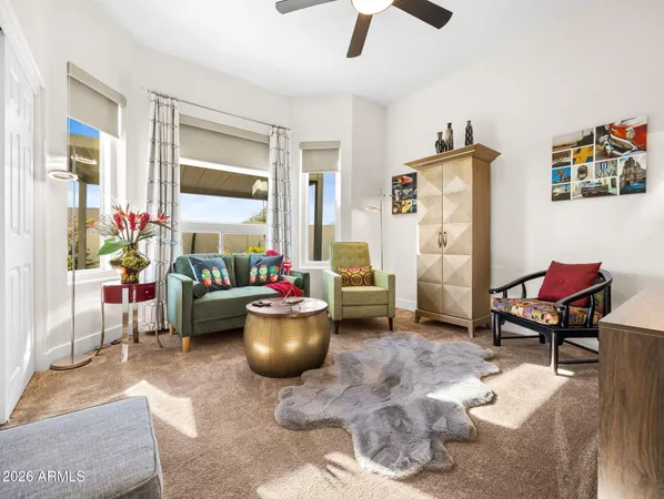 a view of a livingroom with workspace and a couch