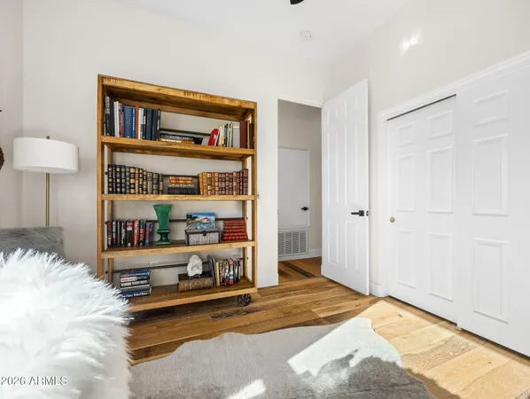 a bedroom with furniture and a window