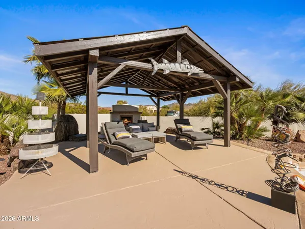 a patio with a table and chairs