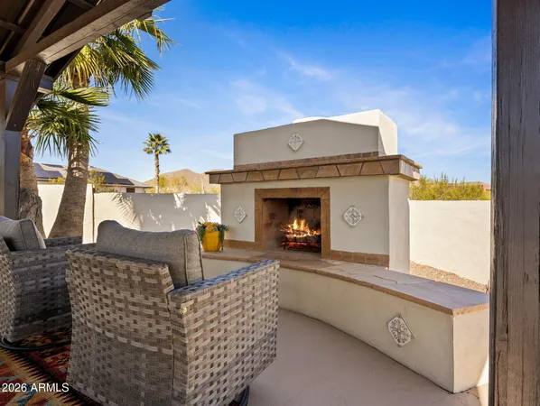 a swimming pool view with a outdoor seating