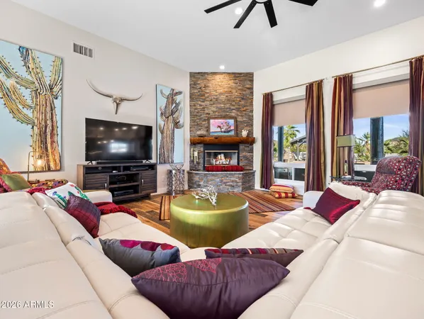 a living room with furniture and a large window